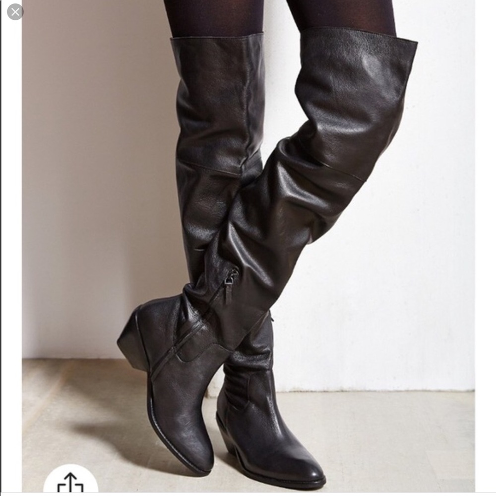 Leather thigh high boots.
